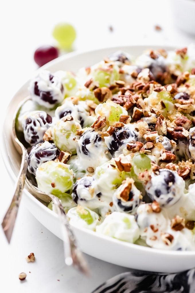 lightened up grape salad in white bowl