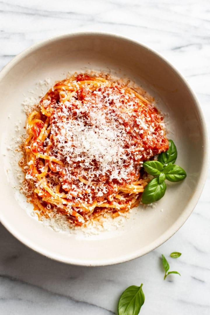 easy homemade marinara sauce over spaghetti in a shallow bowl