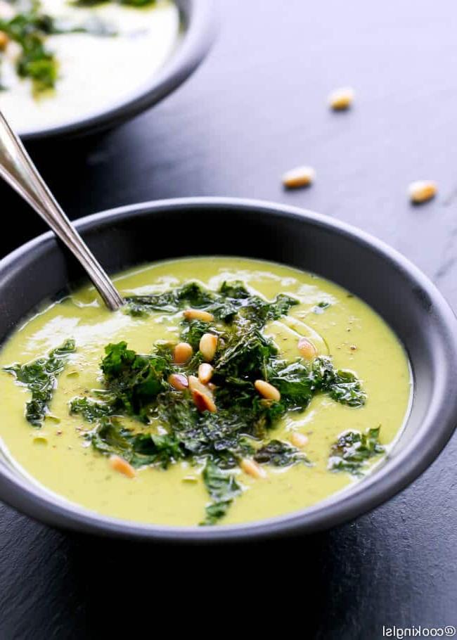 bowl of roasted cauliflower and kale soup with spoon