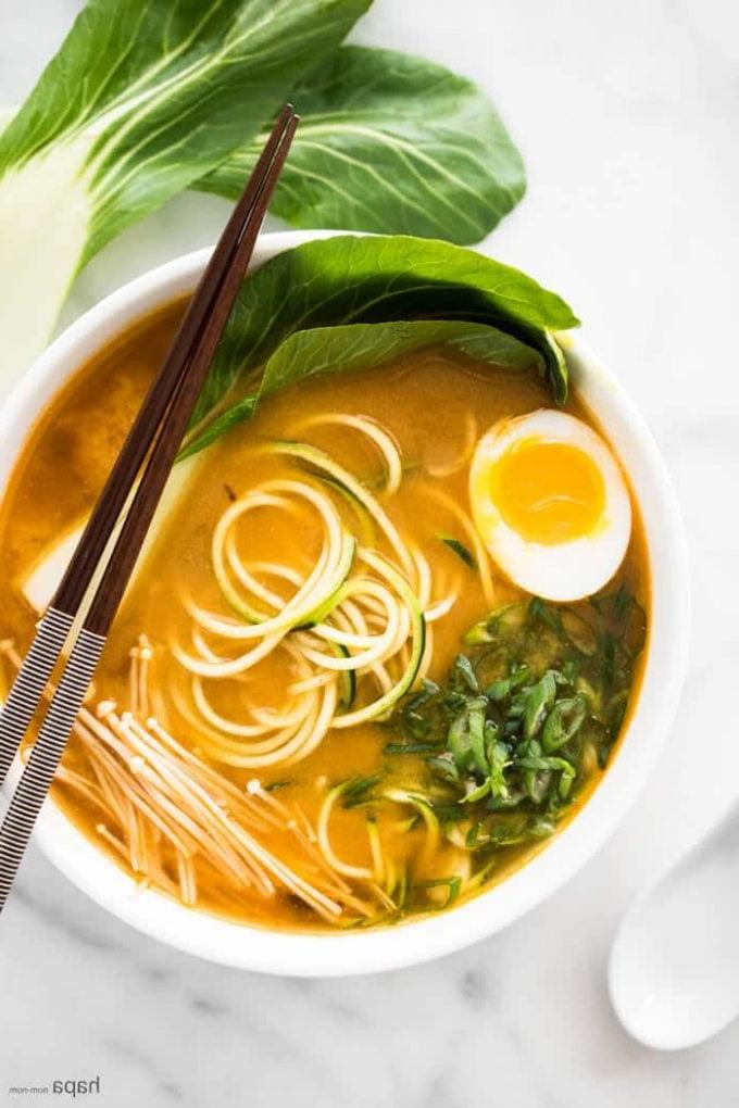 spicy miso zucchini ramen noodles in a bowl with chopsticks