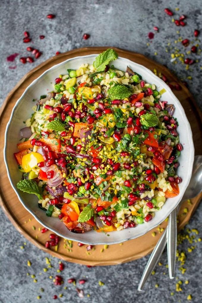 wheat berry risotto with roasted vegetables in a white bowl