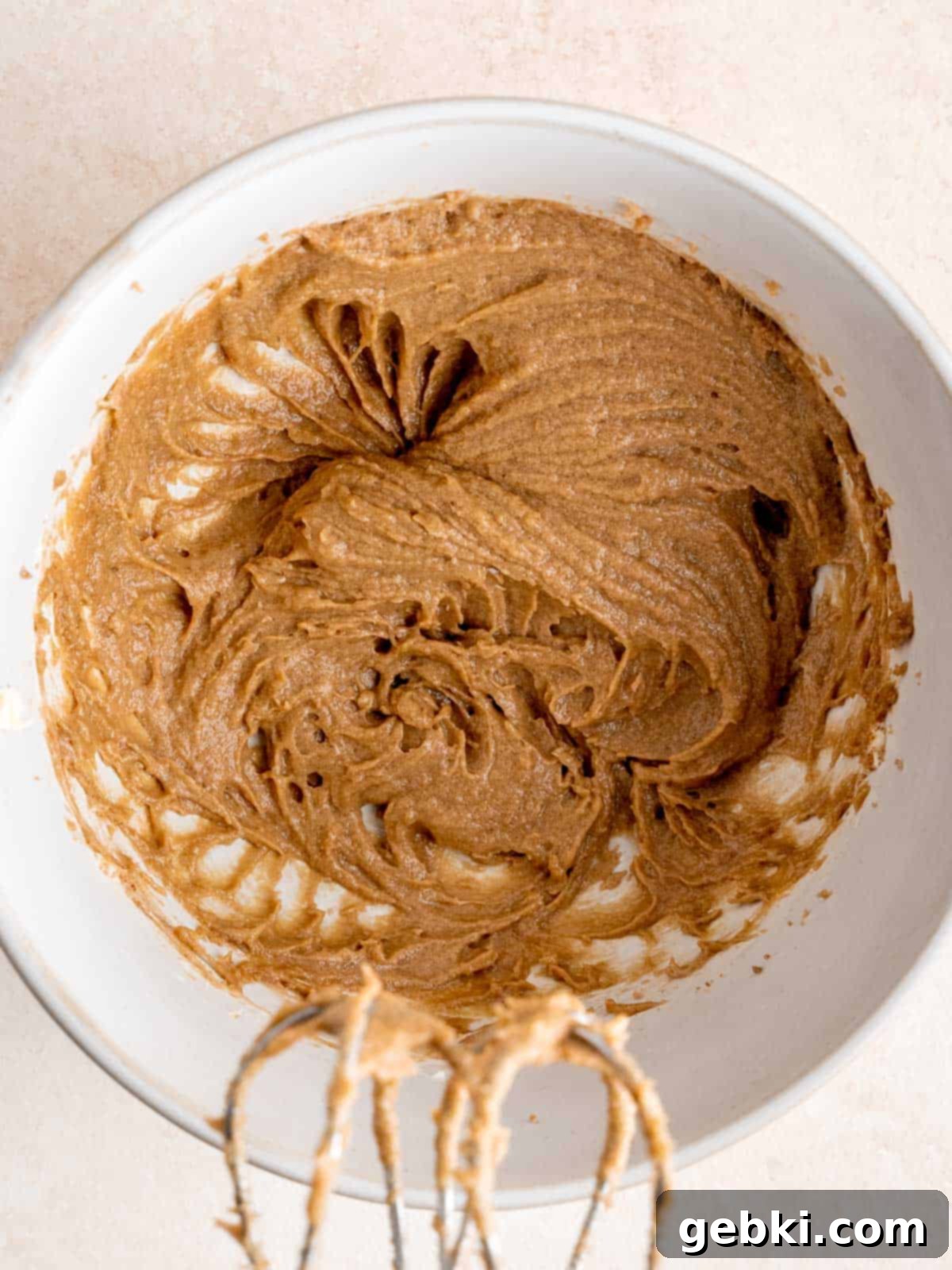 Butter, brown sugar, sourdough discard, egg yolk, and vanilla extract mixed together in a bowl.