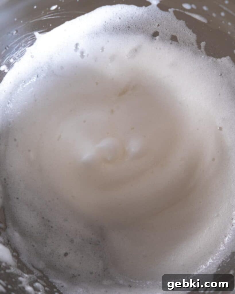 Egg whites and sugar over a double boiler