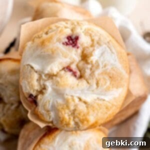 Luscious Strawberry Cream Cheese Muffins 7 Beautifully baked strawberry cream cheese muffin, showcasing its golden top and creamy swirl.