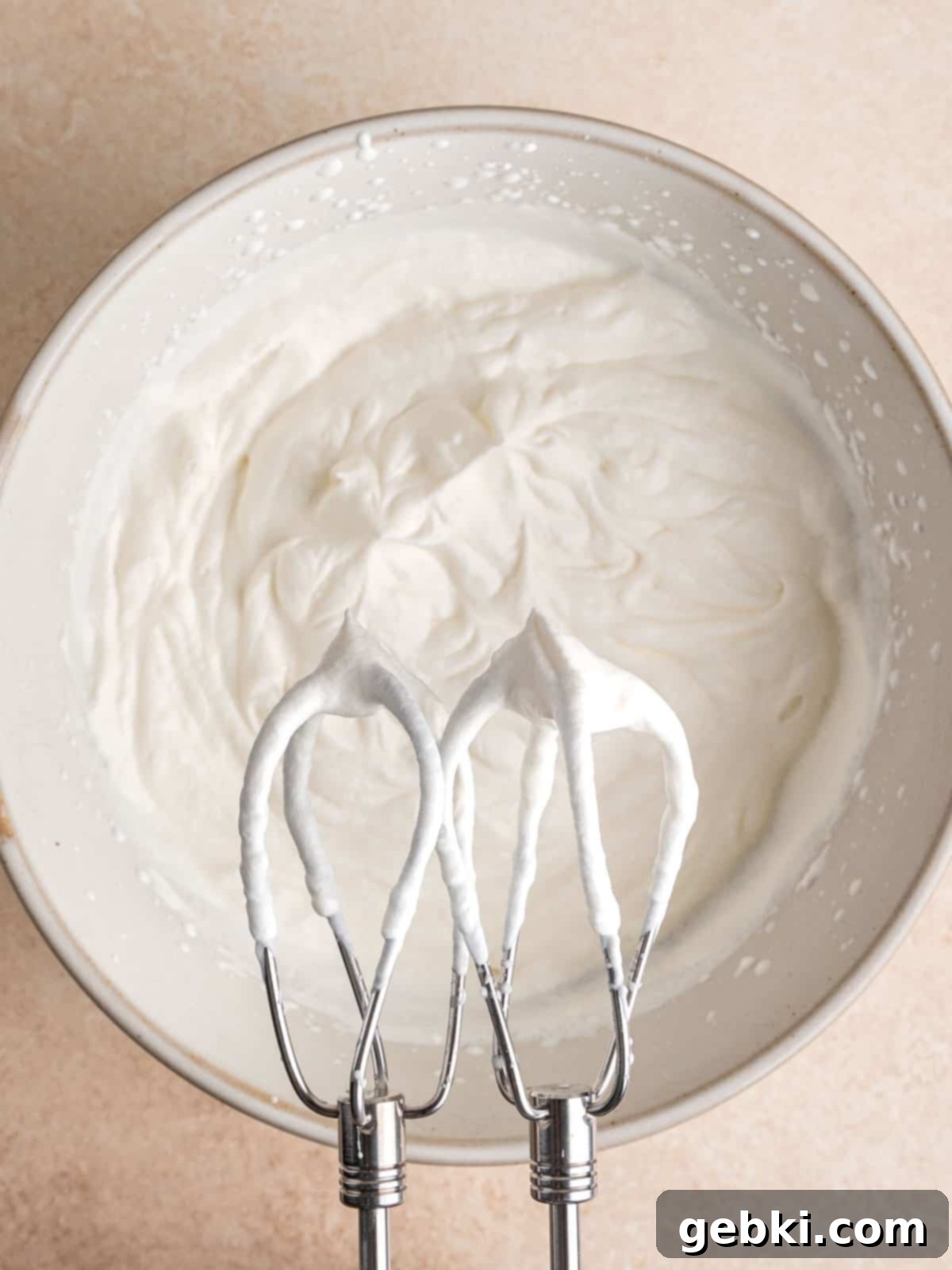 No Bake Strawberry Crunch Cheesecake 6 Heavy whipping cream whipped to stiff peaks in a mixing bowl.