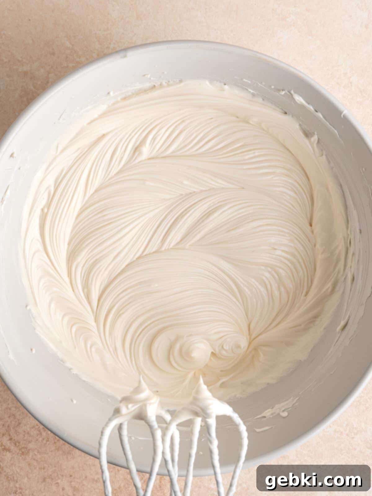 No Bake Strawberry Crunch Cheesecake 7 Cream cheese mixture in a bowl, ready for whipped cream to be folded in.