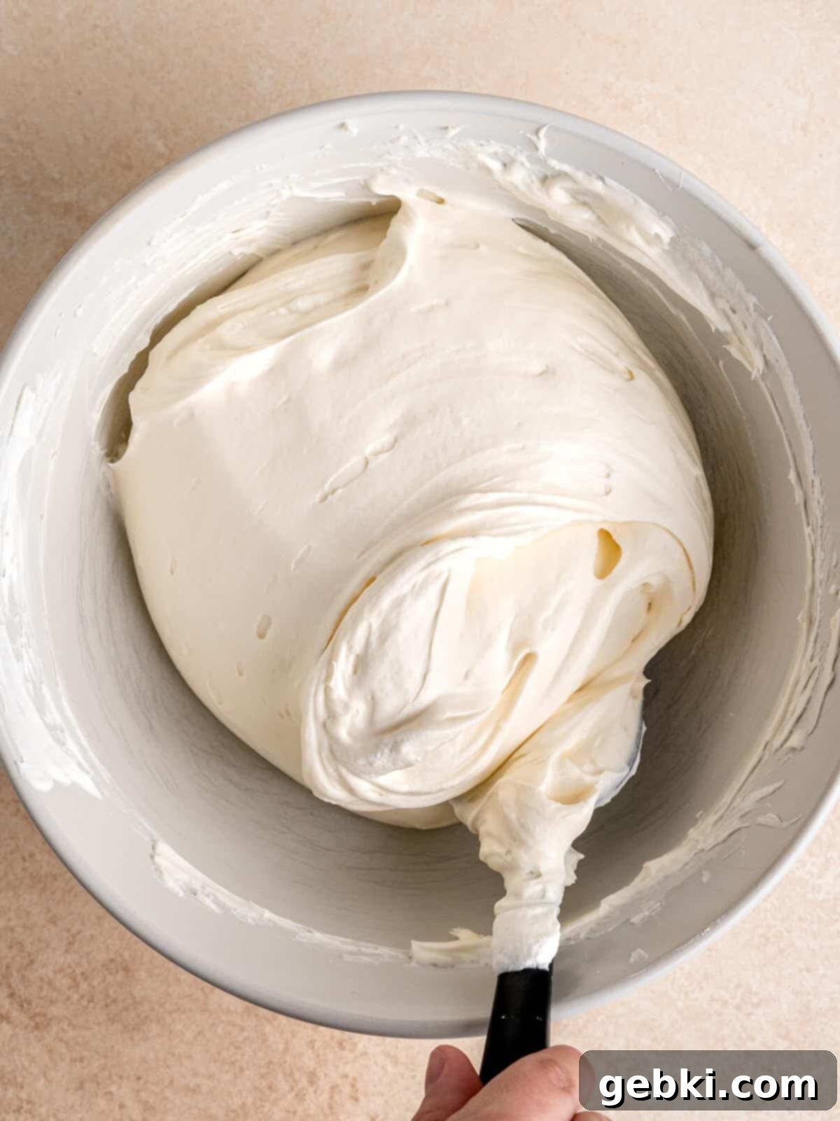 No Bake Strawberry Crunch Cheesecake 8 Gently folding whipped cream into the creamy cheesecake mixture.