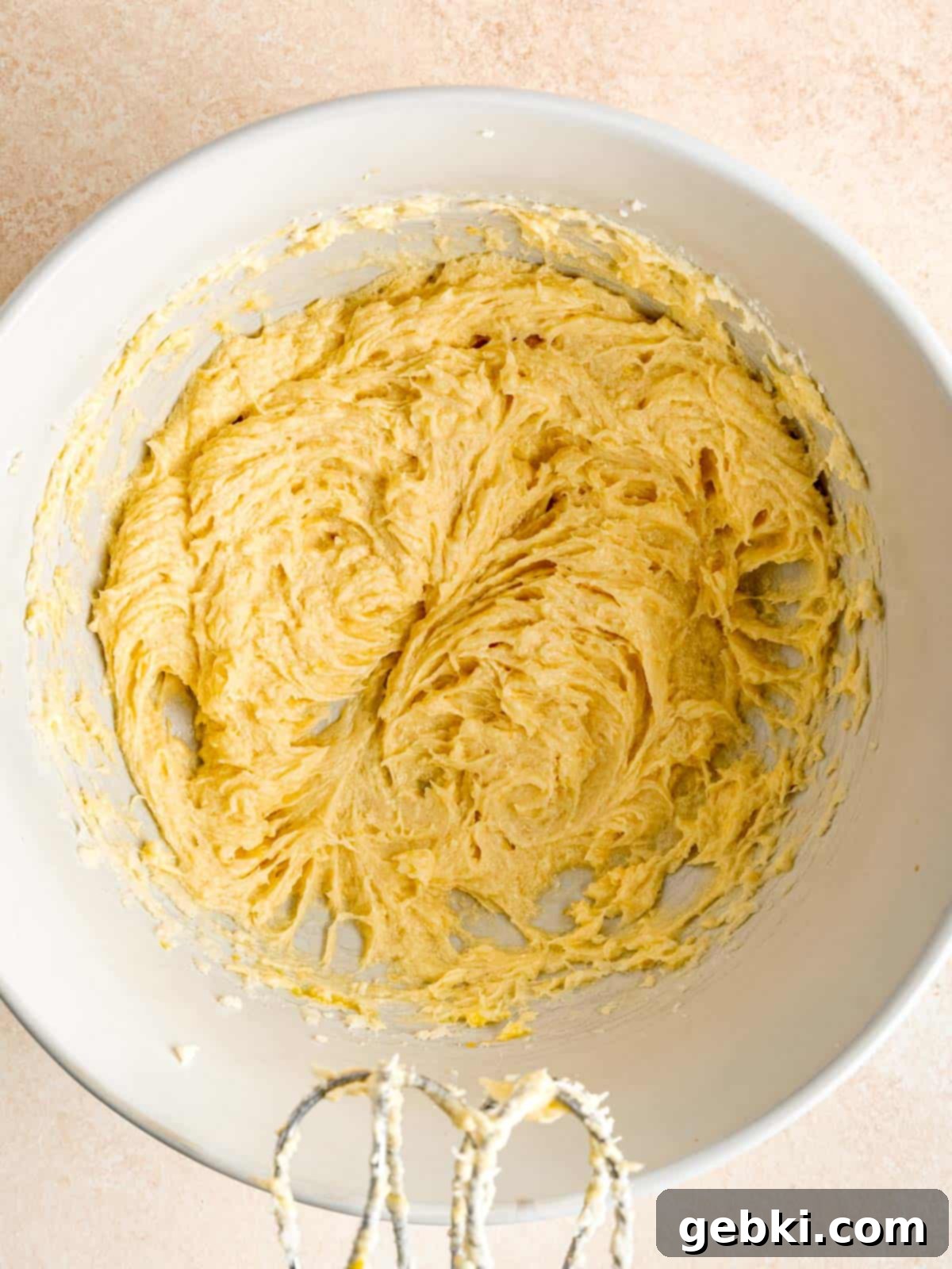 Simple Lemon Curd Thumbprint Cookies 4 Butter, sugar, lemon zest, egg and vanilla extract mixed together in a bowl.