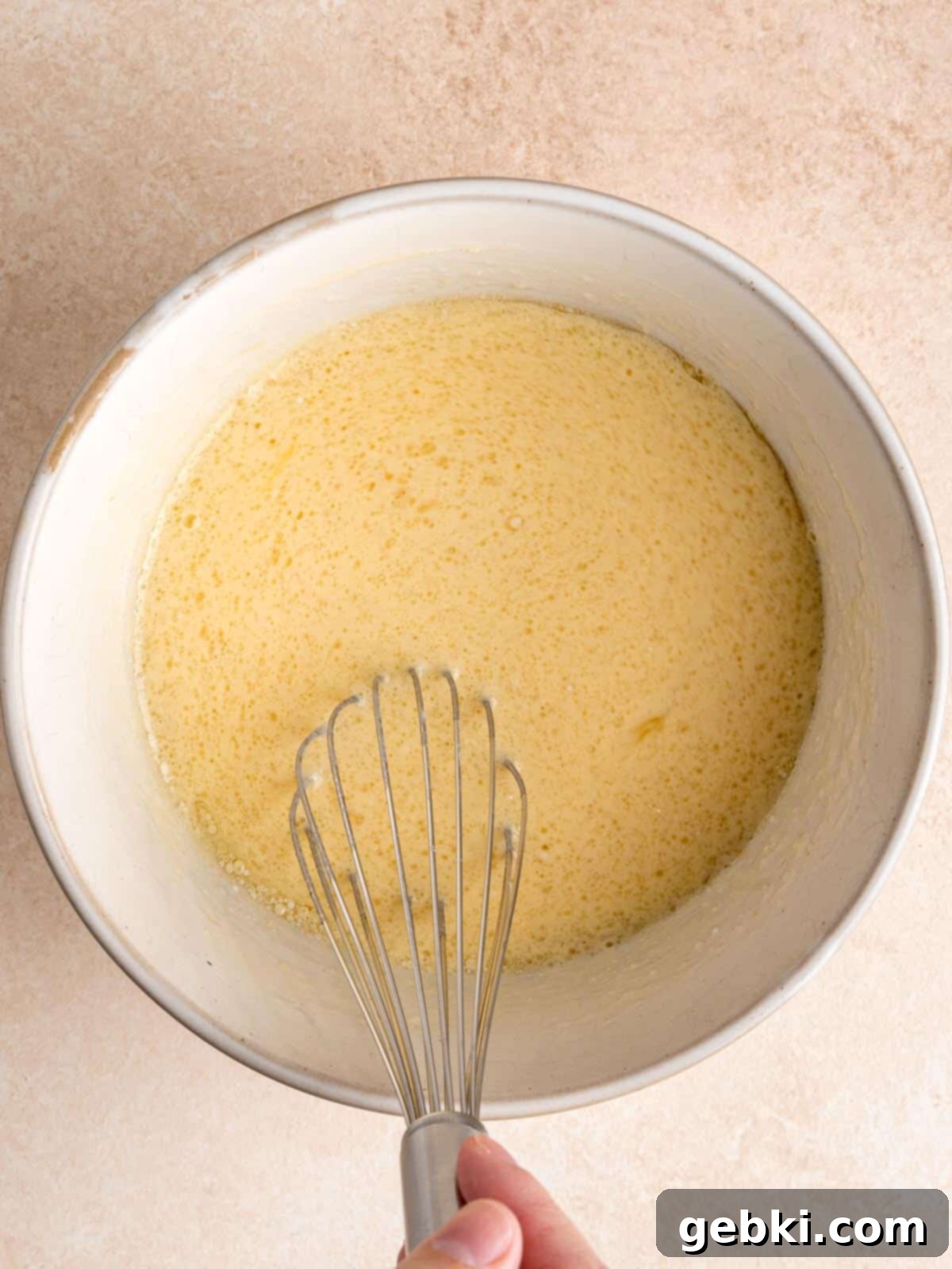 Whisking eggs, buttermilk, vegetable oil and vanilla extract in a medium bowl.