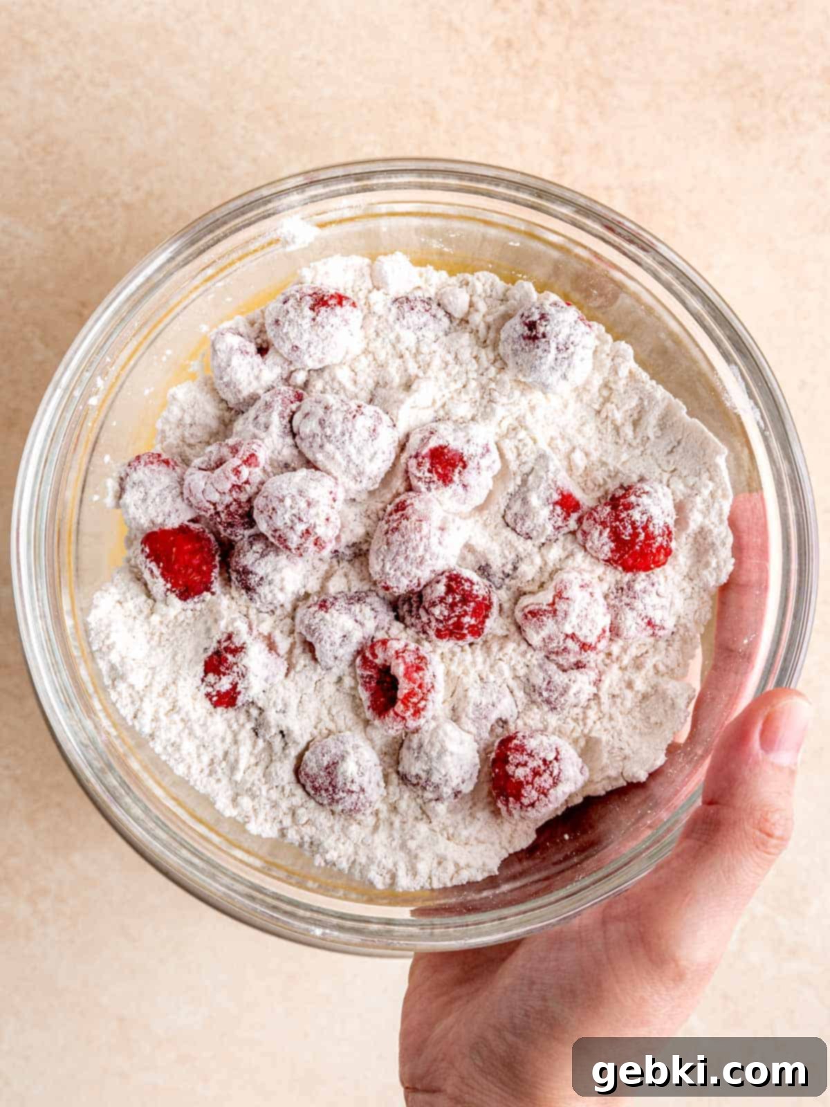 White Chocolate Raspberry Swirl Blondies 5 Fresh raspberries lightly dusted and coated in a small amount of flour to prevent them from sinking during baking.
