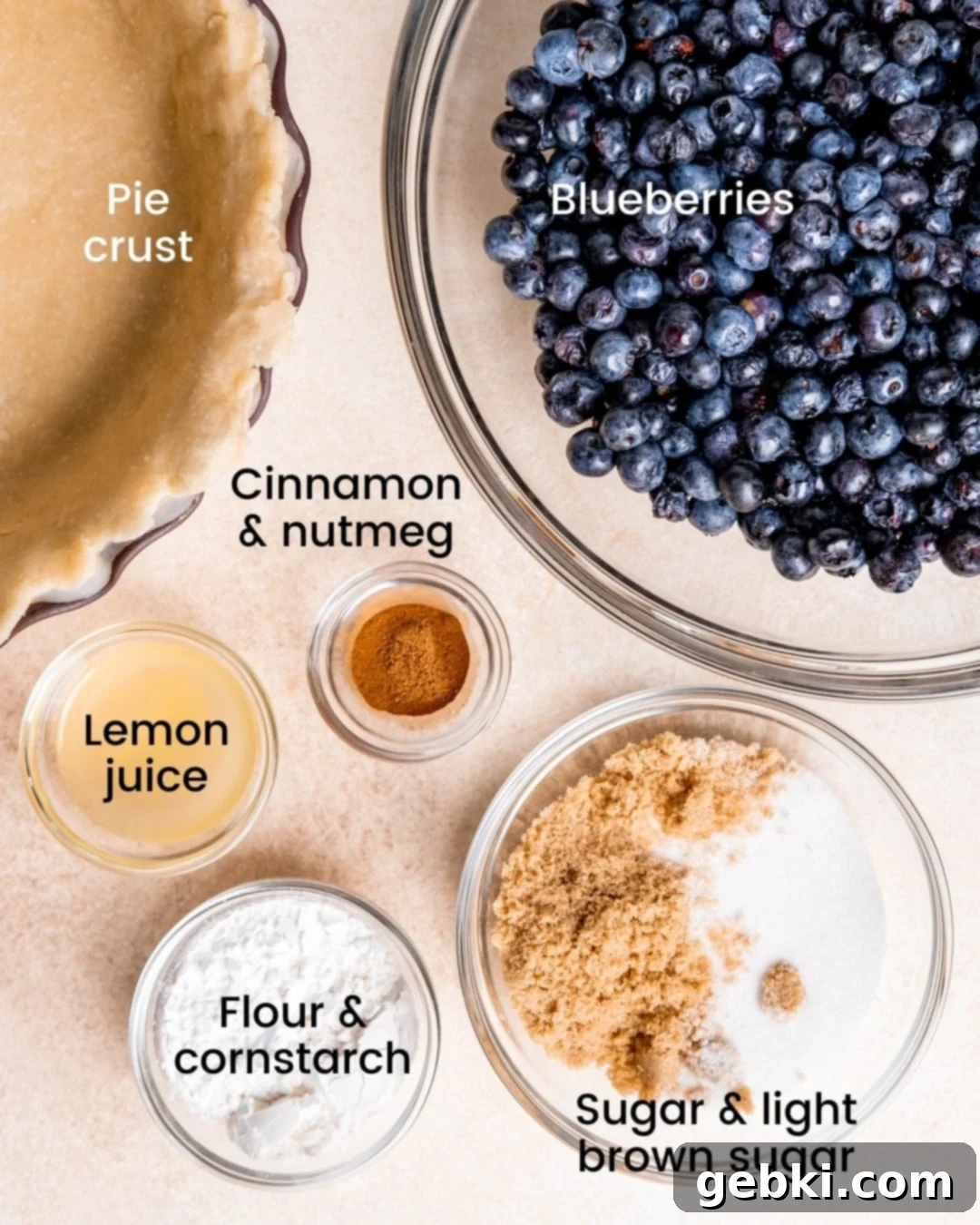 Aromatic Blueberry Delight 3 Spiced blueberry pie ingredients, including fresh blueberries, sugars, spices, and thickeners, neatly laid out and labeled.