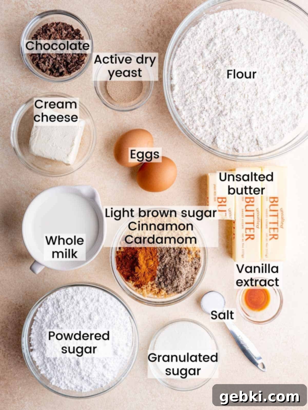 Ingredients needed to make snickerdoodle cinnamon rolls, neatly arranged on a counter.