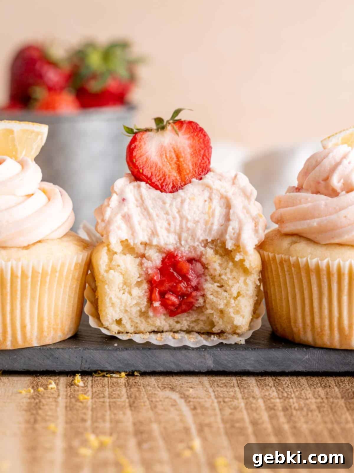Zesty Lemon Cupcakes with Strawberry Filling 2 A fluffy lemon cupcake with strawberry filling and frosting, perfectly showcasing its vibrant summer flavors.