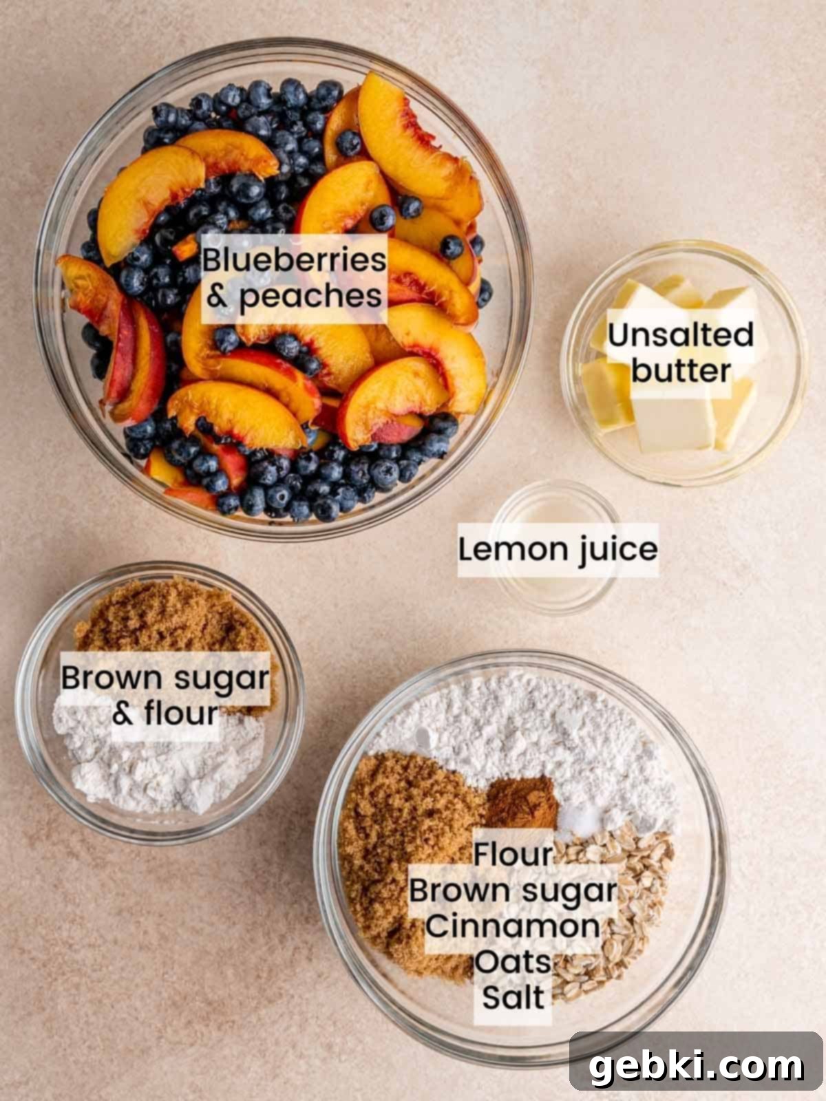 Sweet Summer Blueberry Peach Crisp 3 All the fresh ingredients needed to make a homemade blueberry peach crisp, including peaches, blueberries, oats, flour, and lemon.