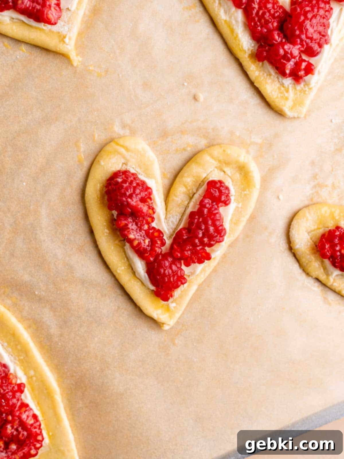 Easy Raspberry Cream Cheese Danish 10 An unbaked heart shaped raspberry cream cheese danish.