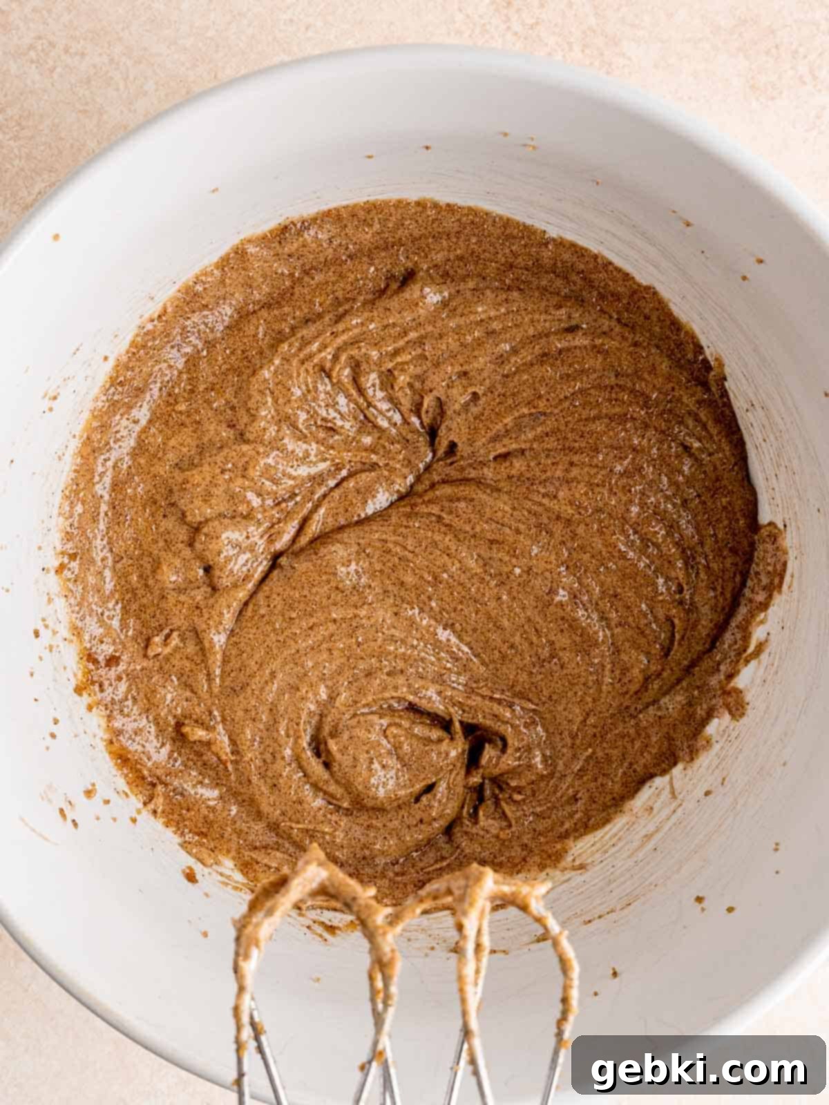 Espresso Sea Salt Chocolate Chip Cookies 5 Espresso cookie wet ingredients mixed in a bowl, a creamy, light brown mixture.