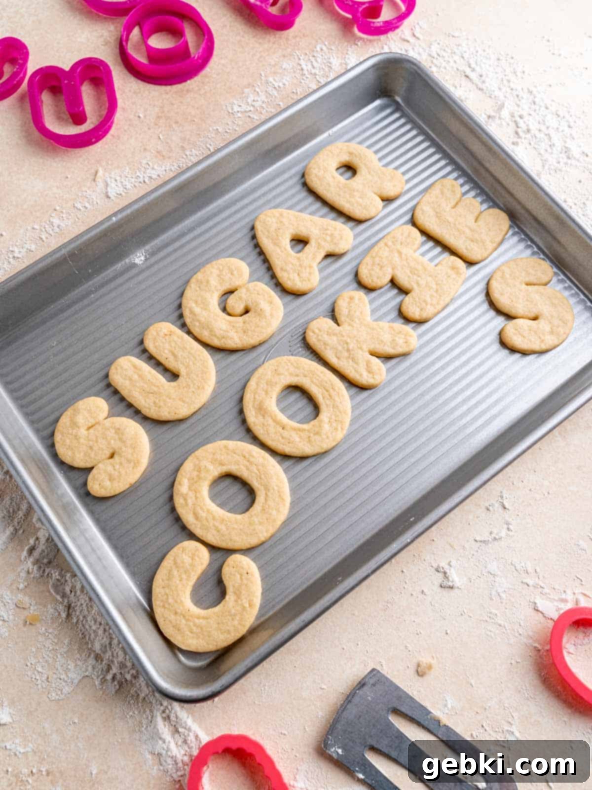 Pillowy Soft Cut-Out Sugar Cookies 8 An inviting angled view of perfectly shaped and baked soft cut out sugar cookies arranged artfully on a cooling rack, highlighting their golden edges and tender appearance.