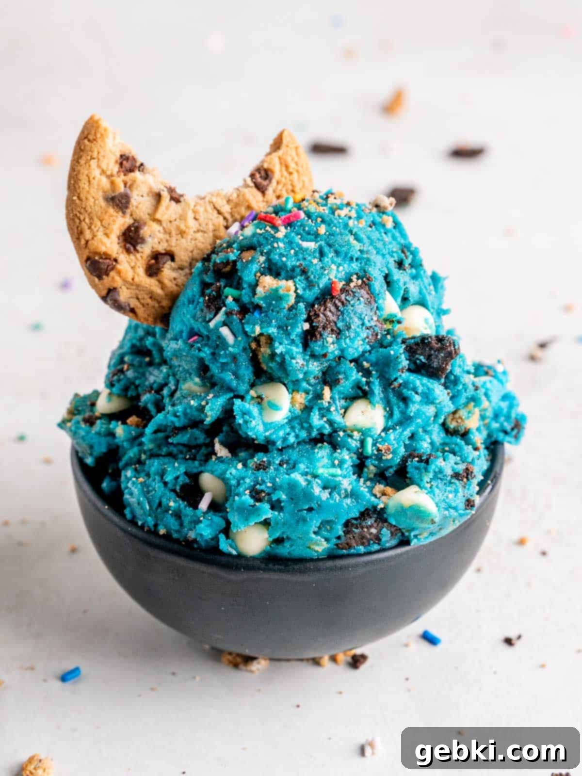 Edible cookie monster cookie dough with a chocolate chip cookie.