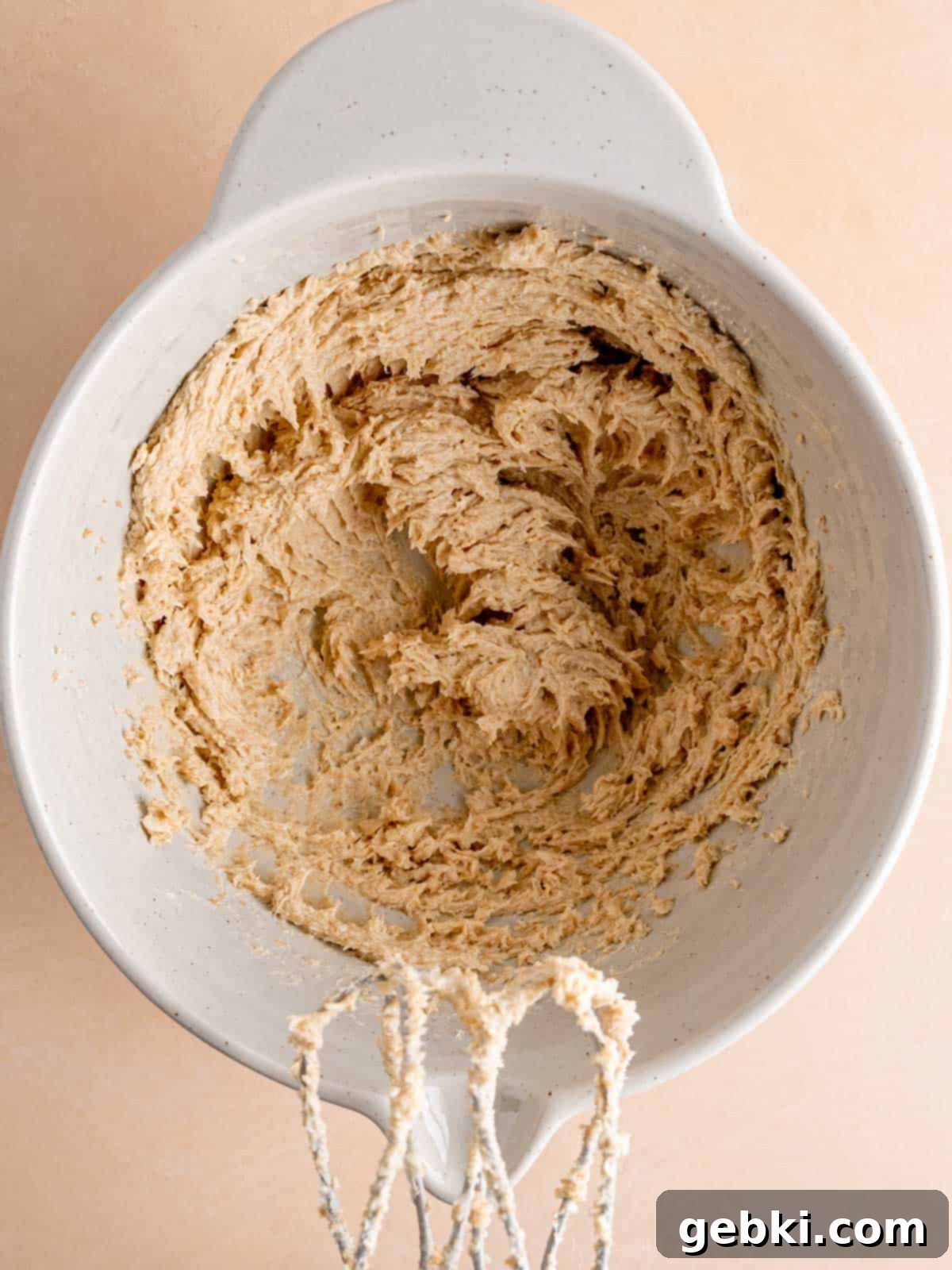 Butter, brown sugar, and vanilla extract mixed together in a bowl.