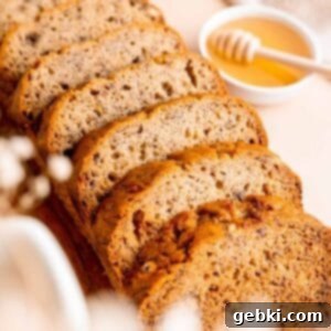 Golden Honey Banana Loaf 11 A perfectly baked loaf of honey banana bread, with a rich golden-brown crust.