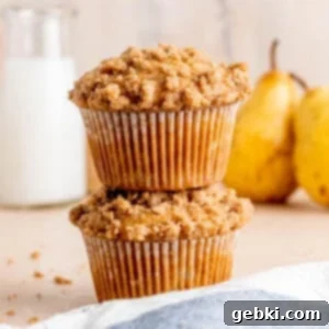 A stack of honey pear muffins with cinnamon streusel.
