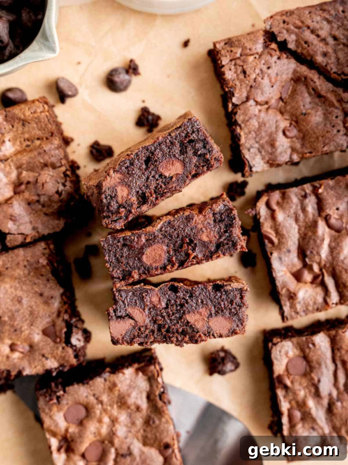 Effortless Fudgy Sourdough Discard Brownies 2 Top view of fudgy sourdough discard brownies with chocolate chips, showcasing their rich texture and shiny, crinkled tops.