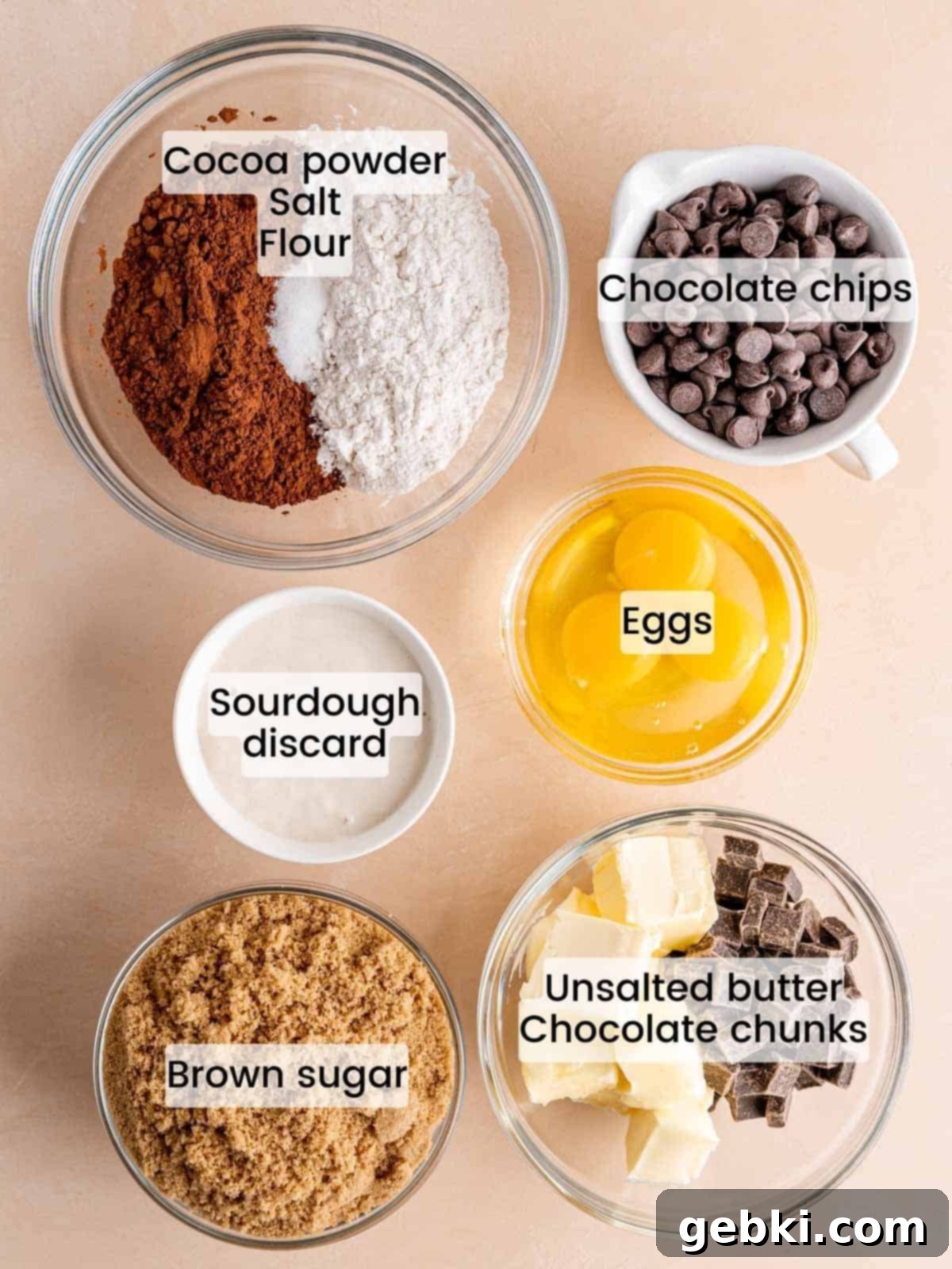 Effortless Fudgy Sourdough Discard Brownies 3 Ingredients needed to make fudgy brownies with sourdough discard, including eggs, sugar, butter, chocolate, flour, and cocoa powder.