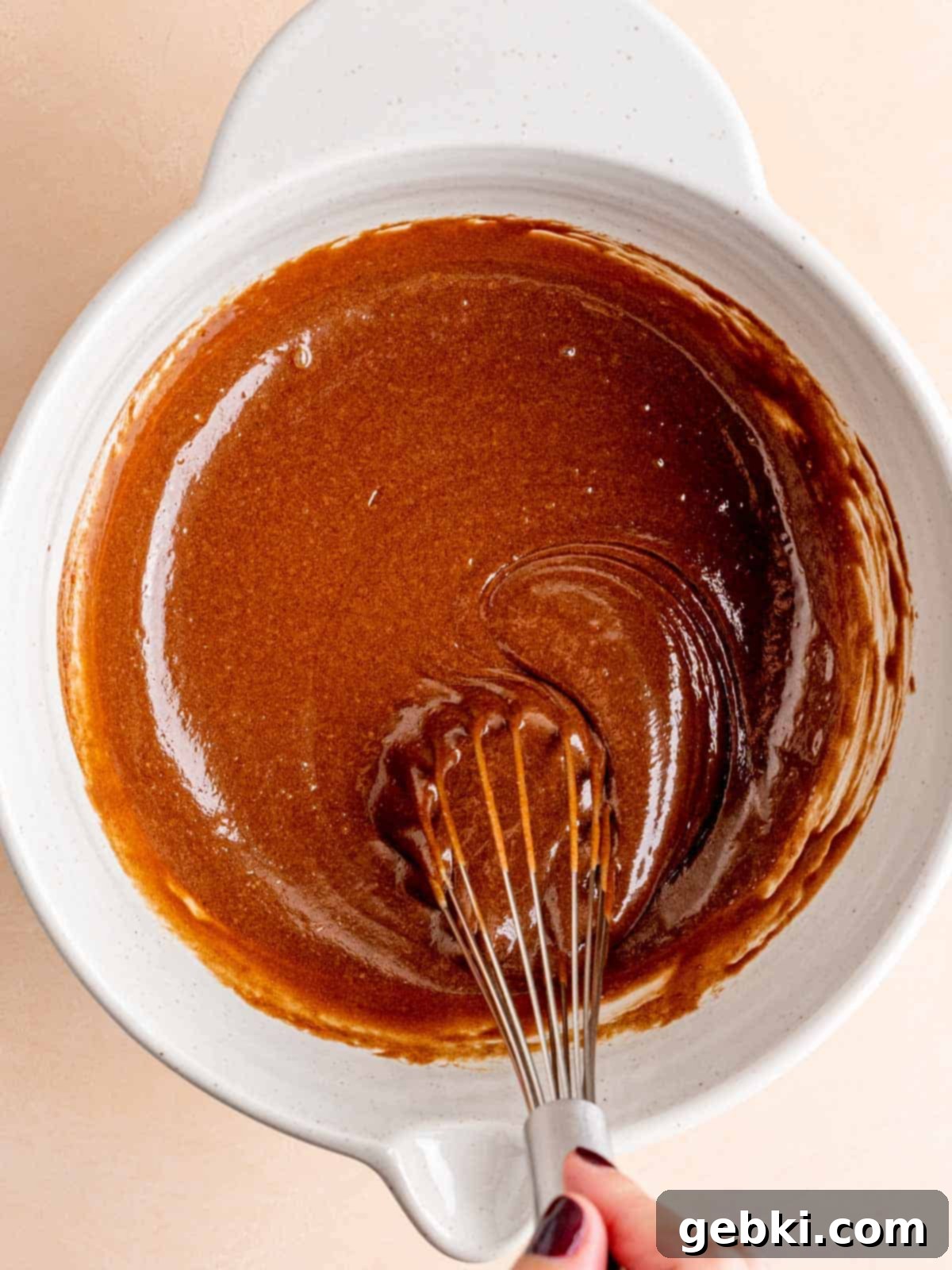 Effortless Fudgy Sourdough Discard Brownies 6 Whisking melted chocolate and butter and sourdough discard into a sugar egg mixture, creating a rich, glossy wet batter.