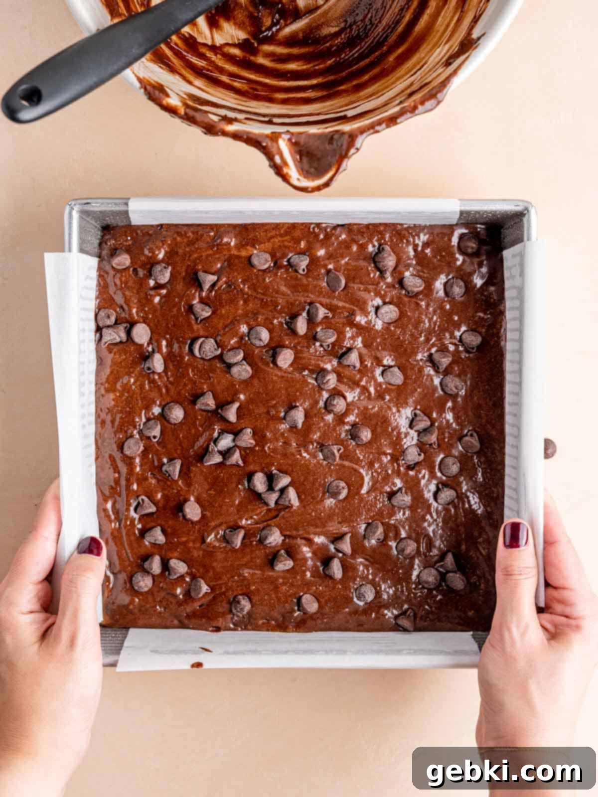 Effortless Fudgy Sourdough Discard Brownies 9 Sourdough discard brownie batter smoothly spread into a square cake pan, ready for baking.