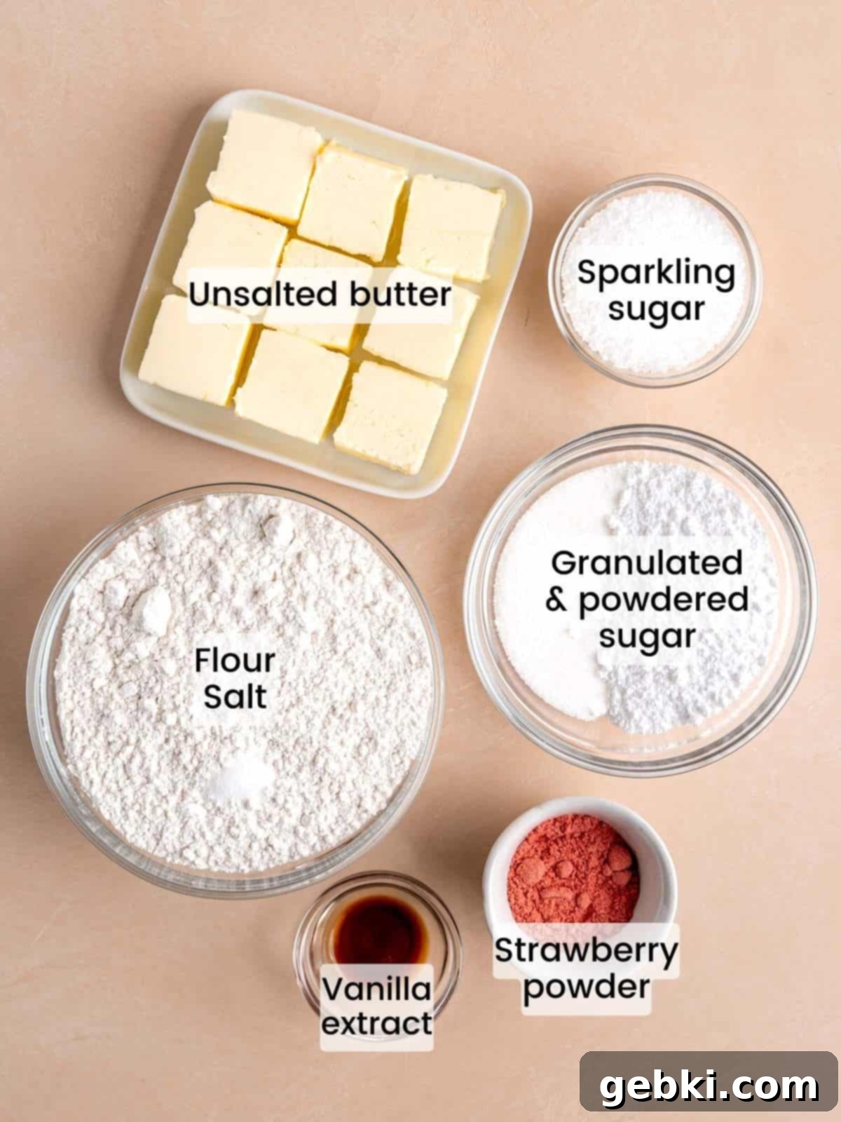 Effortless Strawberry Shortbread Cookies 3 Ingredients needed to make strawberry shortbread cookies, including butter, sugars, strawberry powder, flour, and vanilla.