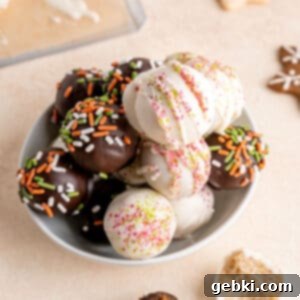 No-Bake Christmas Cookie Truffles 15 A festive image featuring both sugar and gingerbread cookie truffles, beautifully decorated for Christmas.