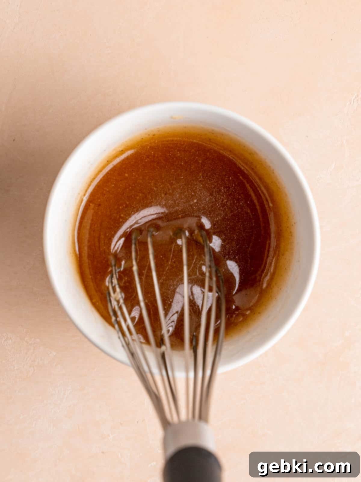 Glazed Honey Bun Cookies Made Easy 4 Whisking melted butter, honey, and cinnamon together in a small bowl to create the glaze.