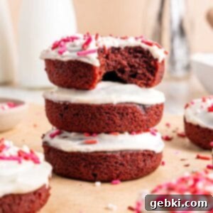 Frosted Red Velvet Donut Indulgence 11 Close up of a red velvet cake donut stack.
