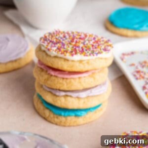 Pillowy Sour Cream Cookies with Sweet Frosting 11 A stack of sour cream cookies with vanilla buttercream frosting.