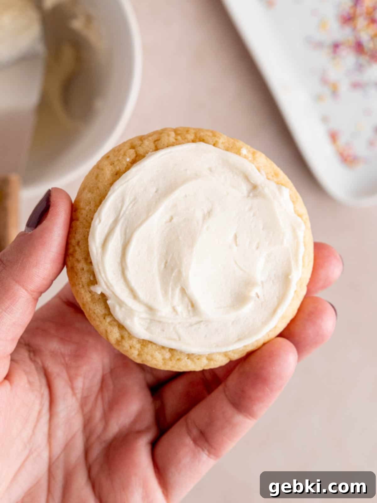 Pillowy Sour Cream Cookies with Sweet Frosting 9 A sour cream cookie frosted with buttercream on top.