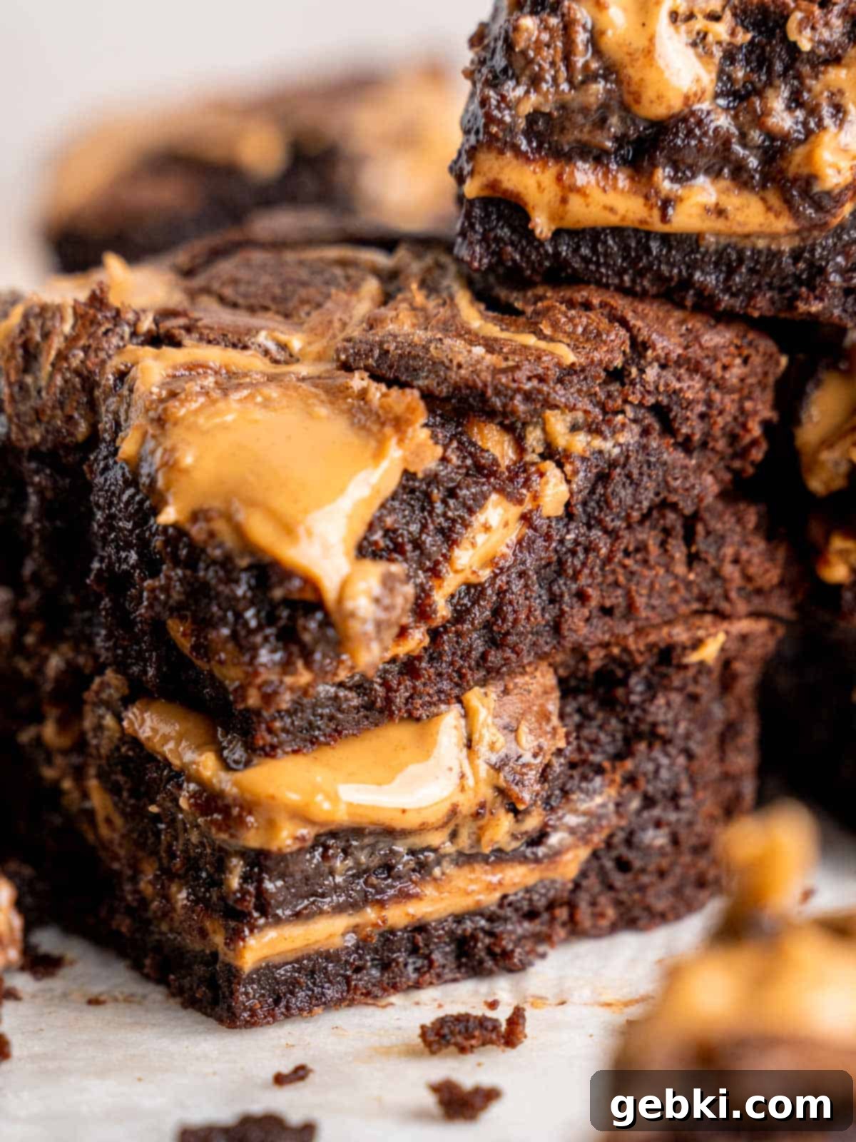 A mouthwatering stack of perfectly cut chocolate peanut butter brownies.