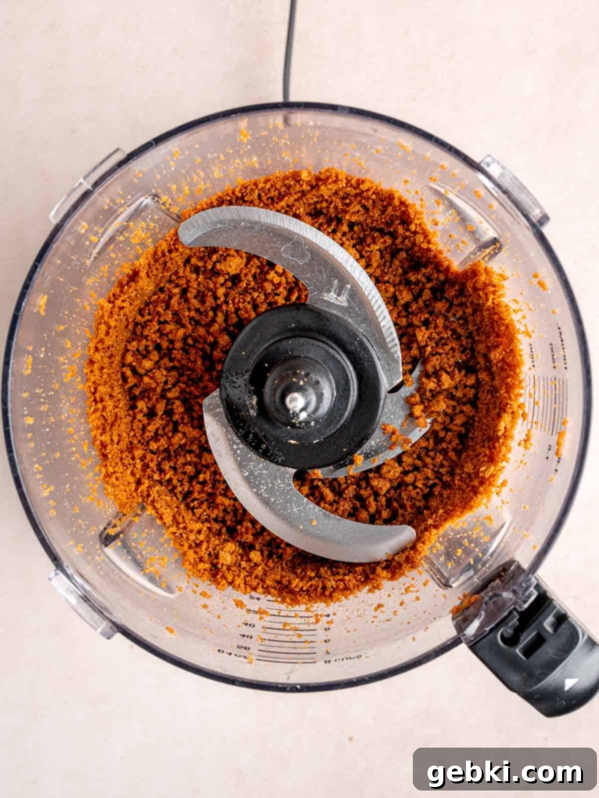 Biscoff cookies, sugar, and melted butter chopped in a food processor.