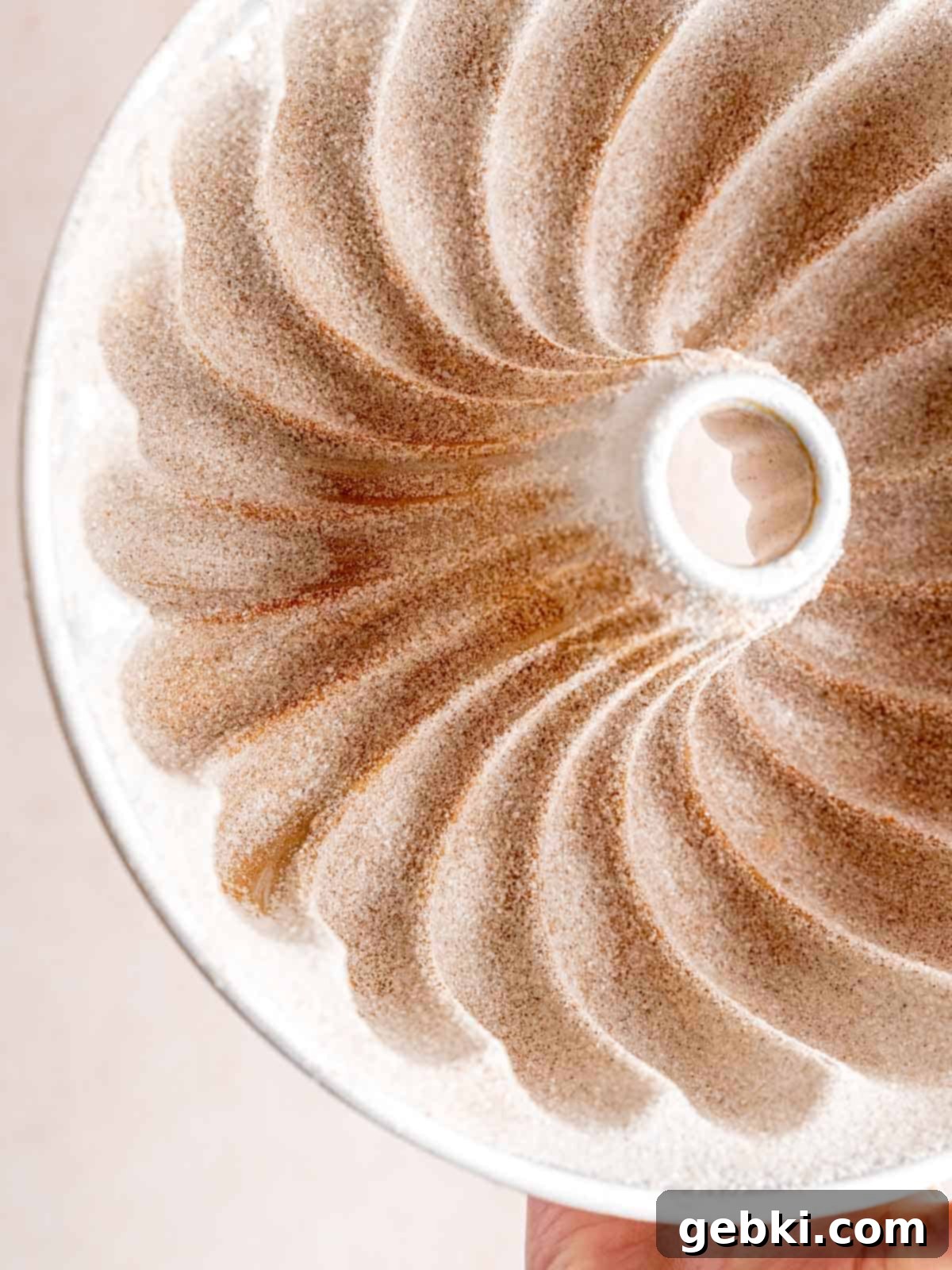 Irresistible Blueberry Sour Cream Coffee Cake 4 Nordic Ware Elegant Bundt Pan coated in butter and cinnamon sugar.