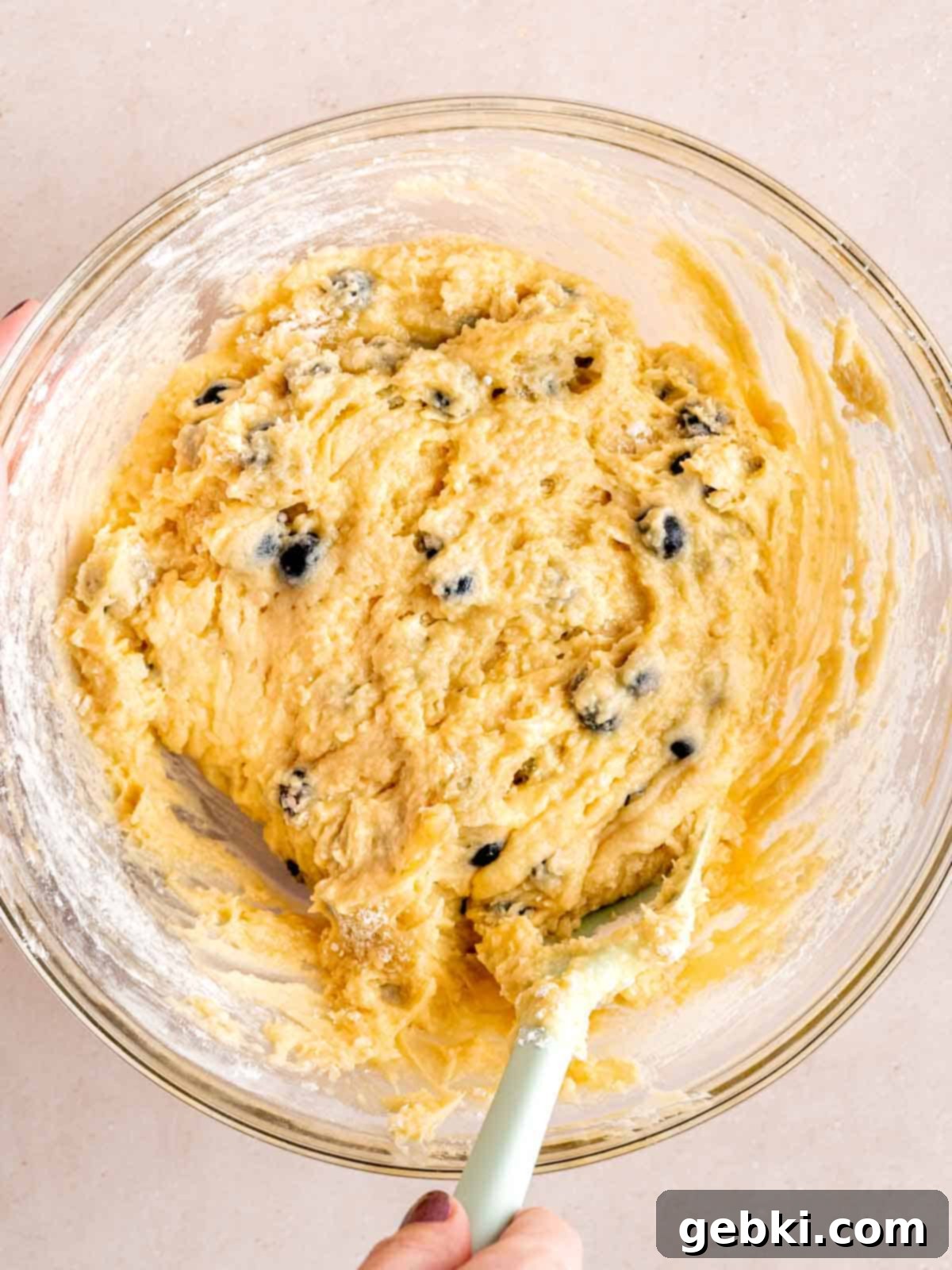 Irresistible Blueberry Sour Cream Coffee Cake 7 Blueberry sour cream coffee cake batter in a bowl.
