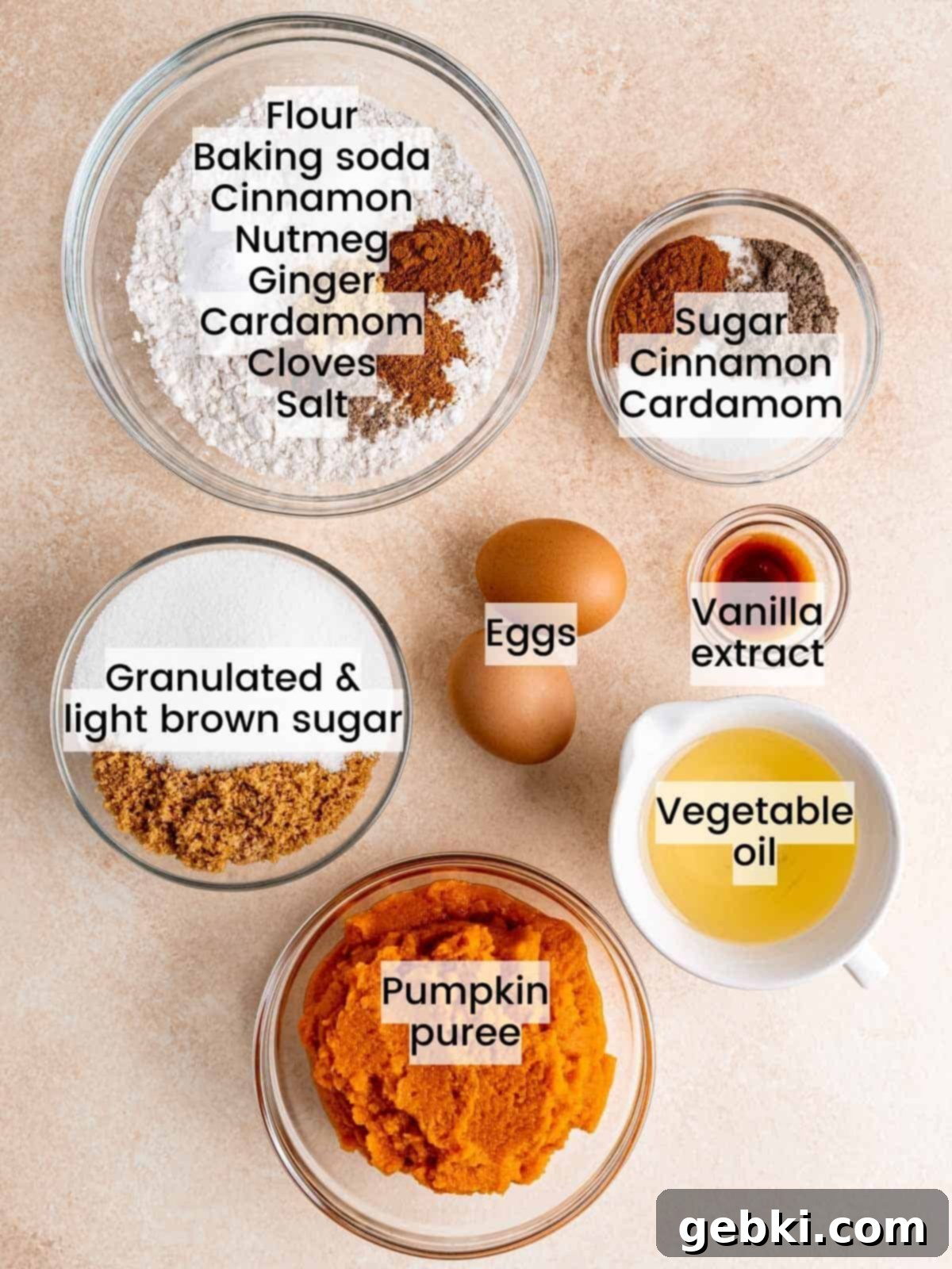 Snickerdoodle Swirl Pumpkin Bread 3 Ingredients needed to make snickerdoodle pumpkin bread, including spices, pumpkin puree, eggs, flour, and sugar.