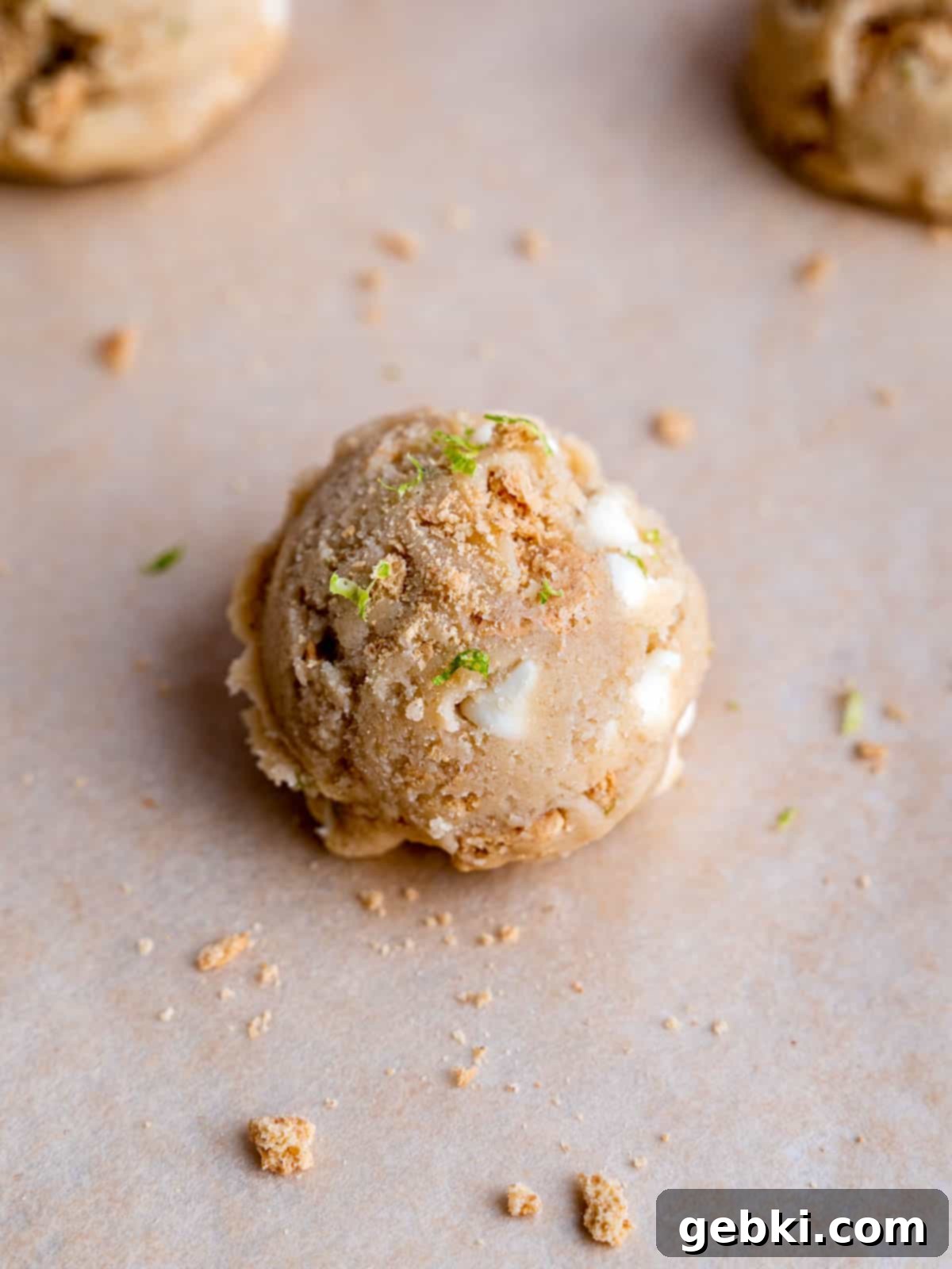Zesty Key Lime White Chocolate Chip Cookies 7 A large scoop of key lime cookie dough, perfectly portioned and ready for baking.