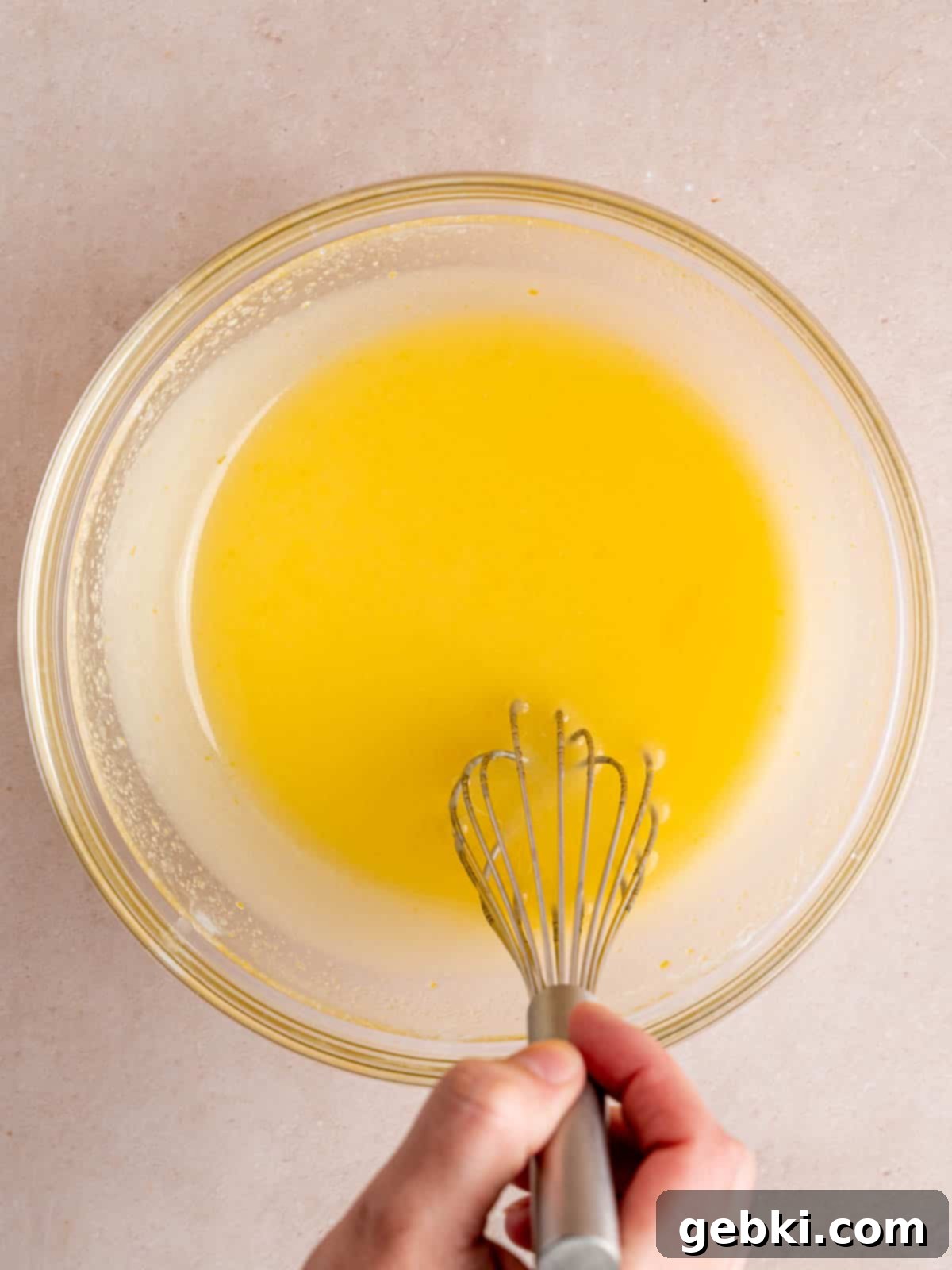 Minty Chocolate Indulgence 4 Whisking sugar, vegetable oil, egg, kefir, and peppermint extract in a bowl.