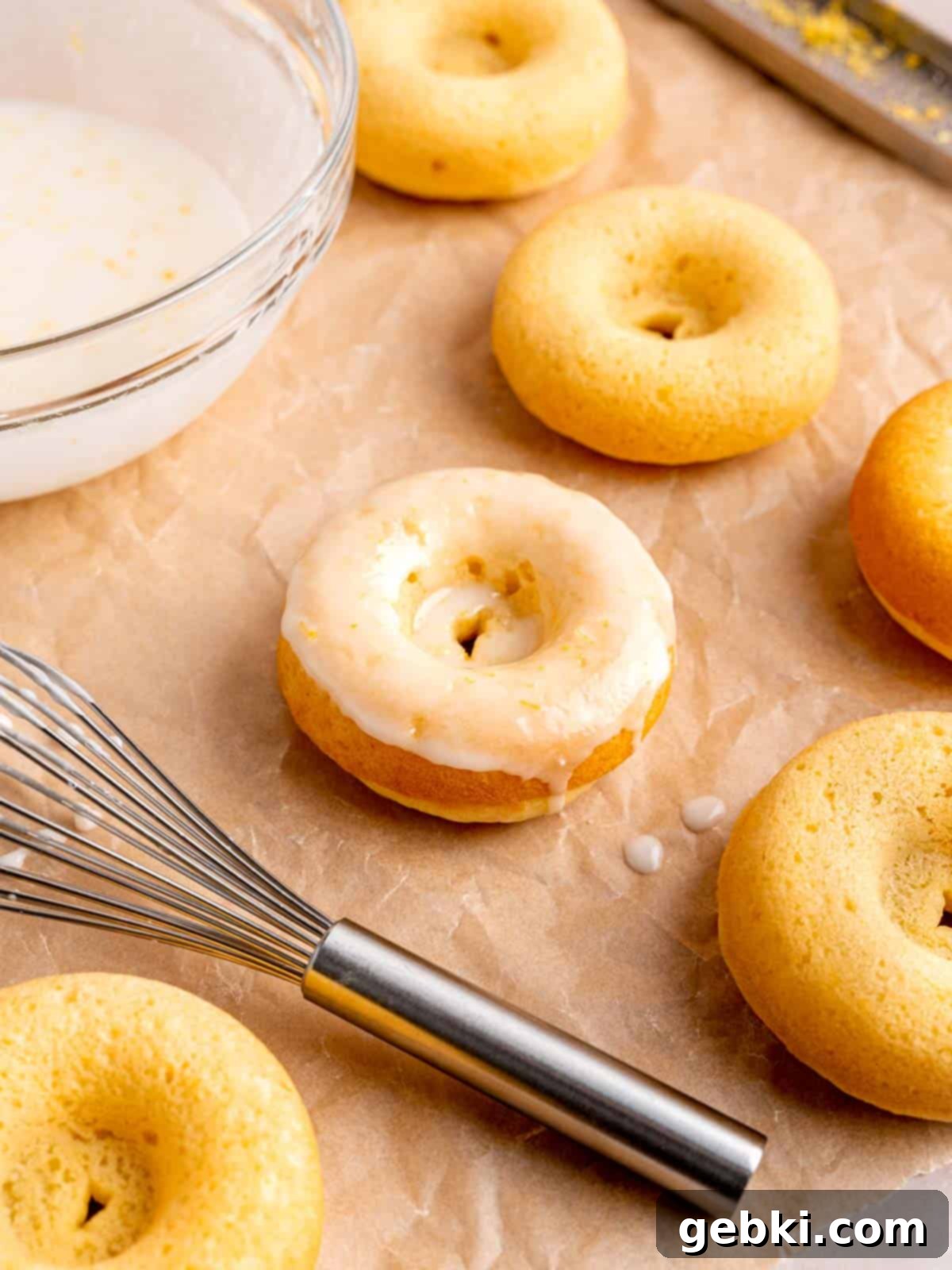 Baked lemon donuts with lemon icing, freshly glazed and ready to eat.