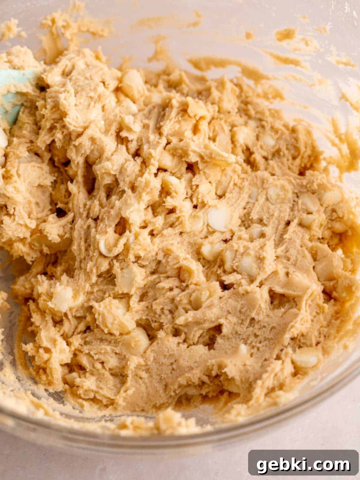 Irresistible White Chocolate Macadamia Nut Cookies 6 White chocolate chip macadamia nut cookie dough in a bowl.
