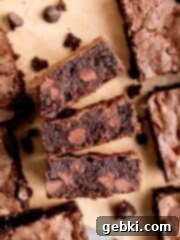 Top view of a pan of beautifully cut fudgy sourdough brownies.