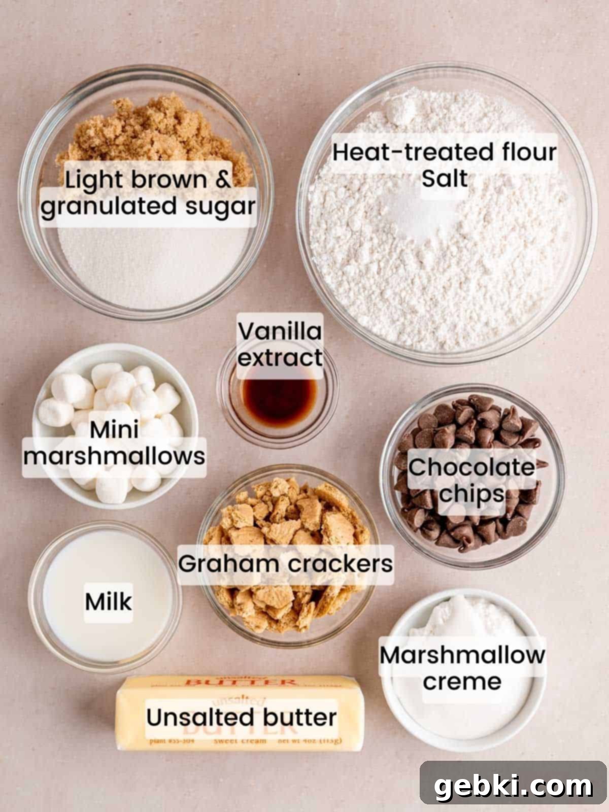 Ultimate S'mores Edible Cookie Dough 3 All the ingredients neatly laid out on a surface for making s'mores edible cookie dough, including flour, butter, sugars, chocolate chips, graham crackers, and marshmallows.