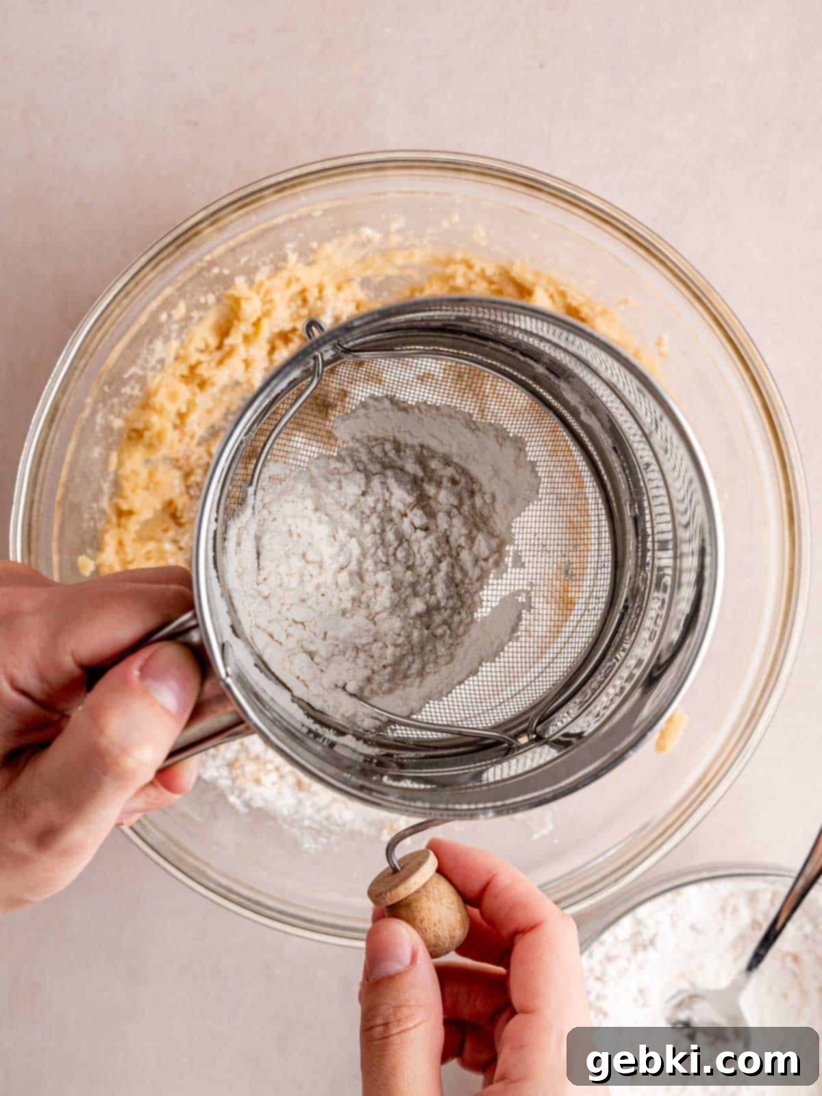 Ultimate S'mores Edible Cookie Dough 5 Sifting heat-treated flour and salt into the butter and sugar mixture for edible cookie dough.