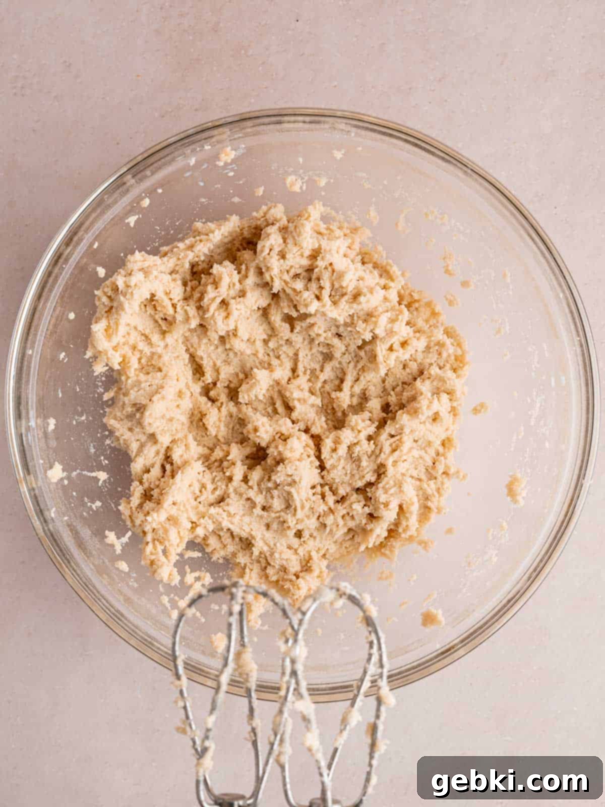 Ultimate S'mores Edible Cookie Dough 6 Edible cookie dough being mixed in a bowl, with milk added to achieve desired consistency.