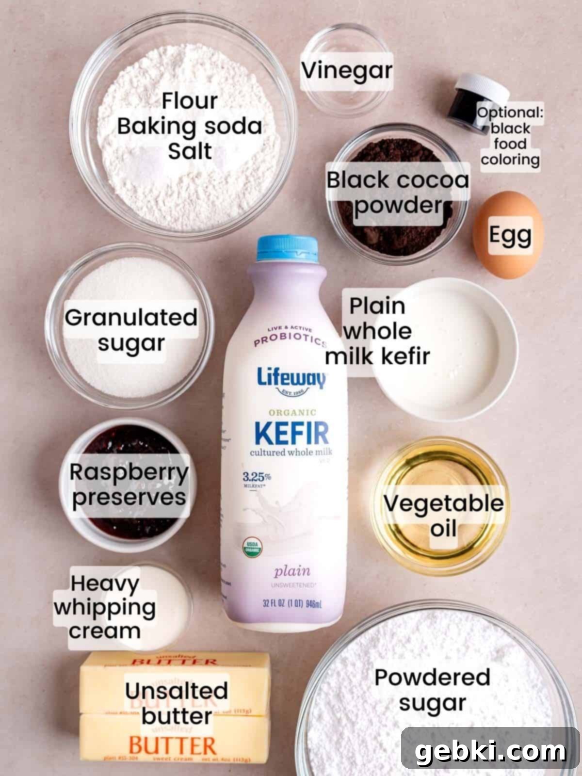 Ingredients needed to make cupcakes with black cocoa powder and raspberry filling.