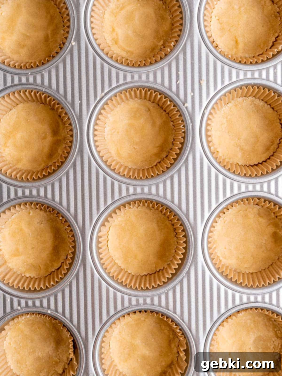 Simply Superior Easy Raspberry Crumble Cookies 6 Shortbread cookie dough pressed evenly into the bottom of muffin liners.